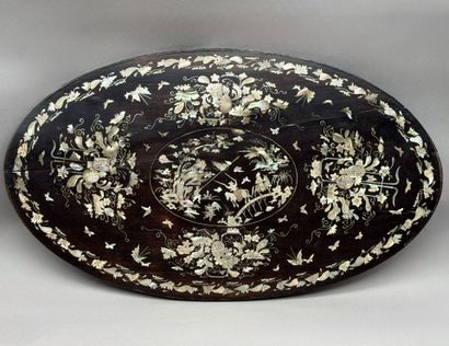 A set of three oval trays made of exotic...