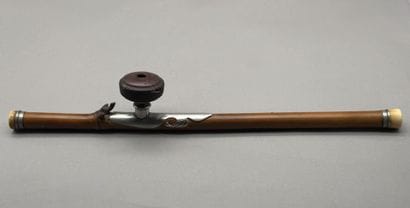 *Bamboo opium pipe with an engraved plaque...