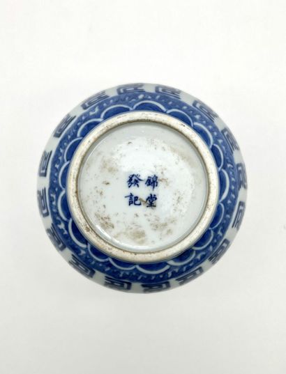 A spouted bowl with a flared neck, made of...