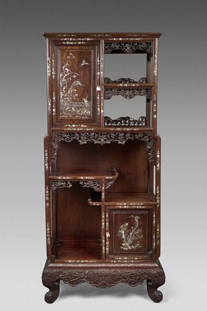 An elegant cabinet made of exotic wood, featuring...