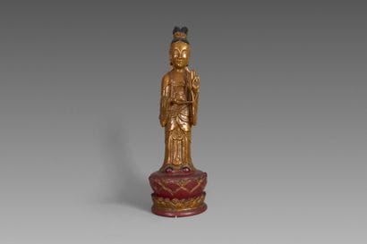 Statuette of a deity depicted standing on...