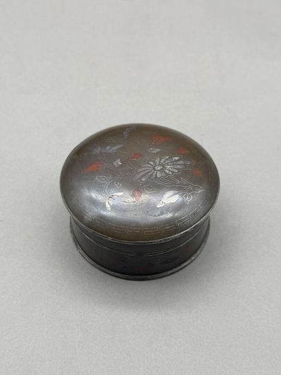 Round, lidded bronze box decorated with silver...