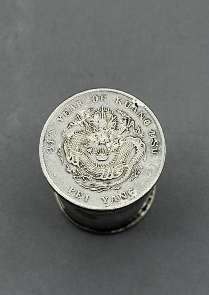 A cylindrical opium box made of silver-plated...