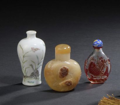 Three snuffboxes made of agate, porcelain...