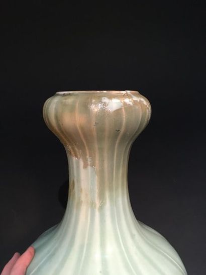 Celadon porcelain vase
China, 19th century
The...