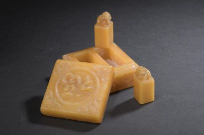 Covered box and its two small stamps in orange-yellow...