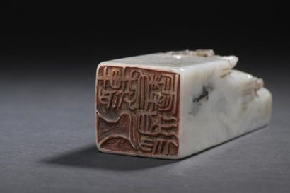 Grey stone stamp
China
The upper part of...
