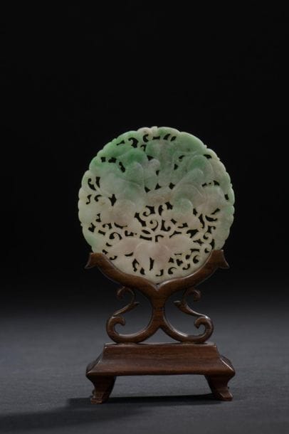 Small jadeite plaque
China, 20th century
Circular,...