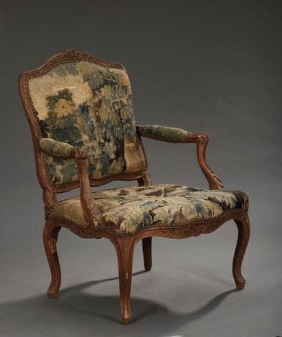 Large armchair in molded and carved wood...