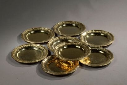 ODIOT
Eighteen gilt plates, Minerva punch,...
