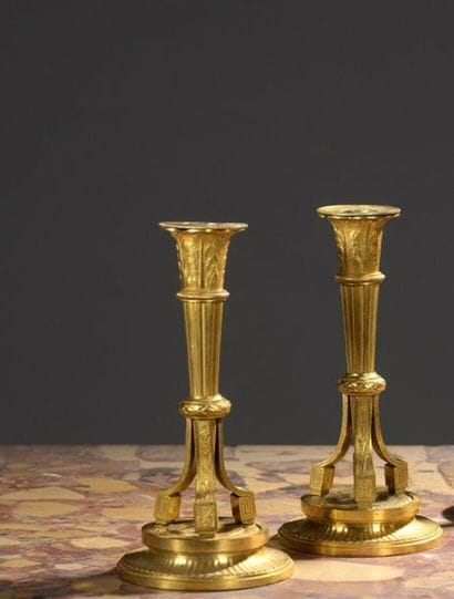 Pair of gilt bronze candleholders from the...