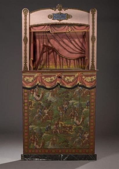 Théâtre Guignol en bois et papier mâché,...