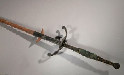 Two-handed sword. Wooden fuse, covered with...