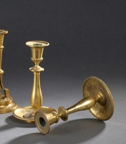 A pair of Louis XVI
period gilt bronze candleholders...