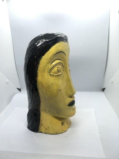Glazed terracotta woman's head, circa 1950
H....