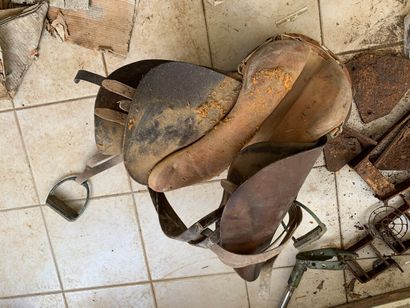 Leather saddle, covered with a canvas co...