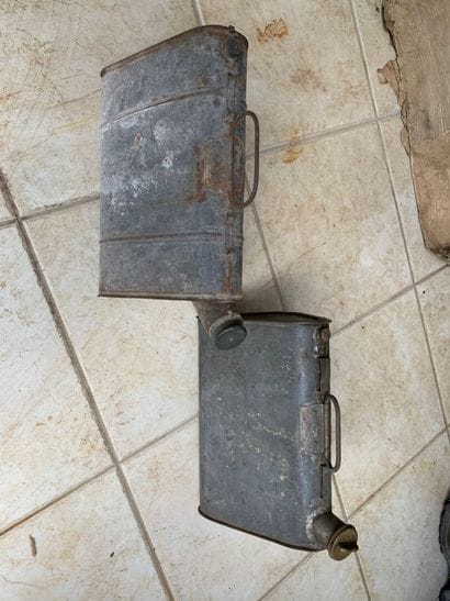 Set of 2 triangular fuel cans.