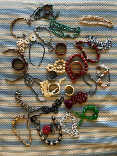 Lot of fancy necklaces and bracelets.
