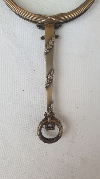 
Leather case containing a silver magnifying...