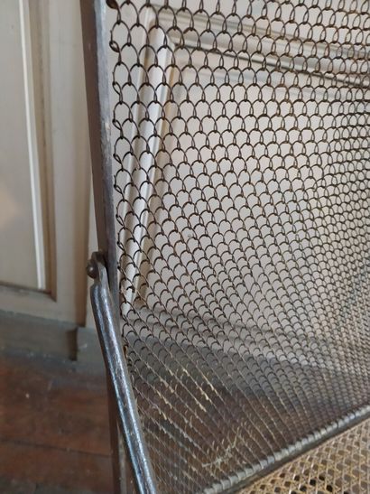 Pair of wrought iron armchairs, 19th century

Caned...