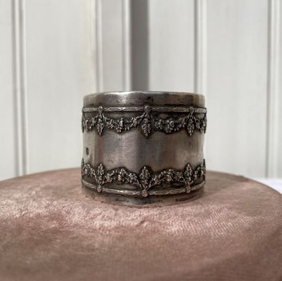 Set of two napkin rings and an egg cup.

Silver...