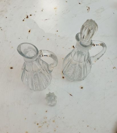 MANNETTE including :

A pair of decanters,...