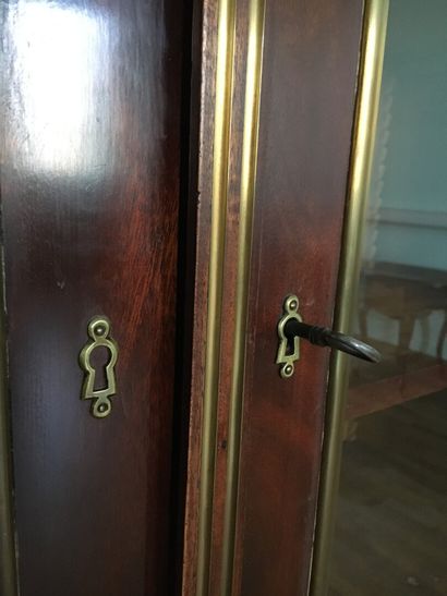 Mahogany and mahogany veneer showcase in...