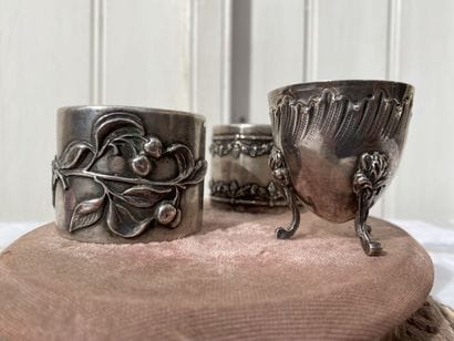Set of two napkin rings and an egg cup.

Silver...
