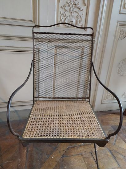 Pair of wrought iron armchairs, 19th century

Caned...