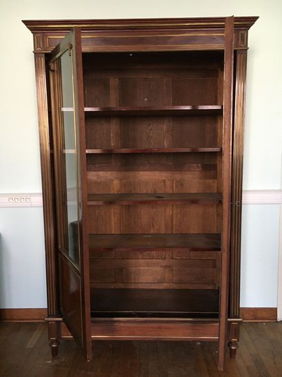 Mahogany and mahogany veneer showcase in...