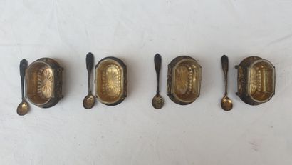 Four silver saltshakers and their shovels,...