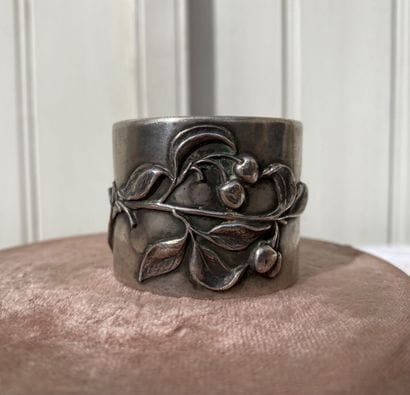 Set of two napkin rings and an egg cup.

Silver...