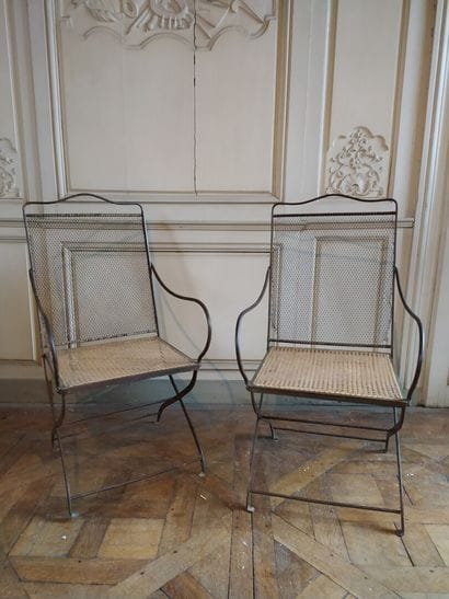Pair of wrought iron armchairs, 19th century

Caned...