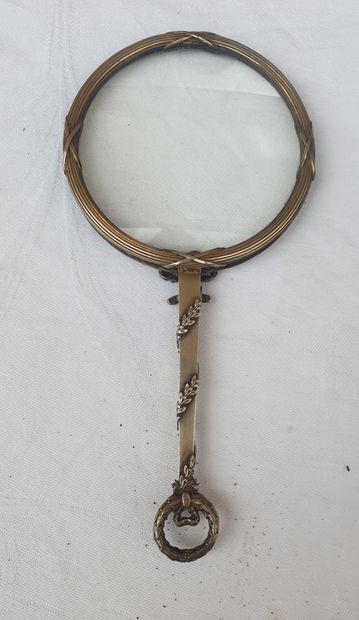 
Leather case containing a silver magnifying...