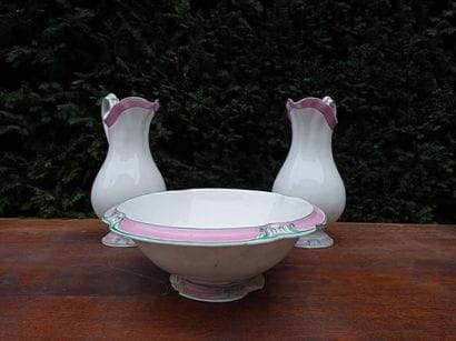 Two ewers and a bowl in glazed earthenware,...