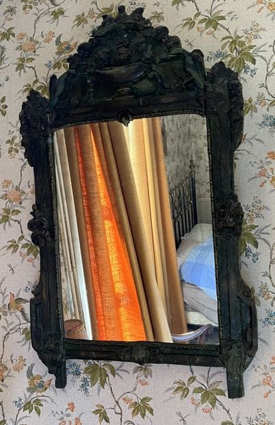 Carved and repainted wood window from the...