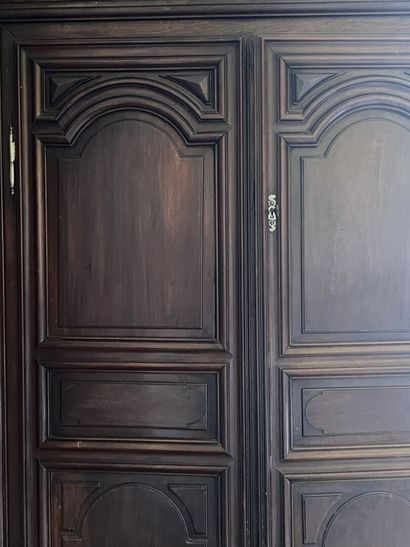 Molded and carved walnut cabinet from the...