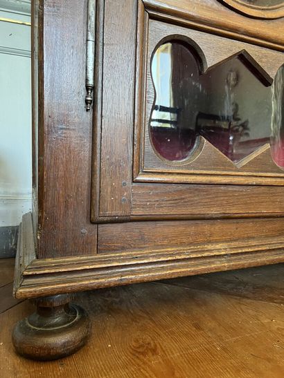 Glass cabinet in natural wood partly from...