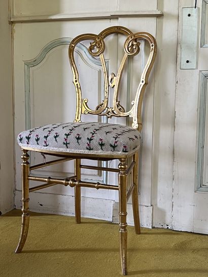 Suite of four chairs in carved and gilded...