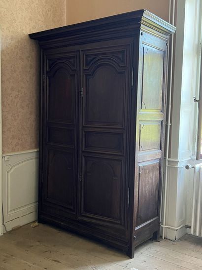 Molded and carved walnut cabinet from the...