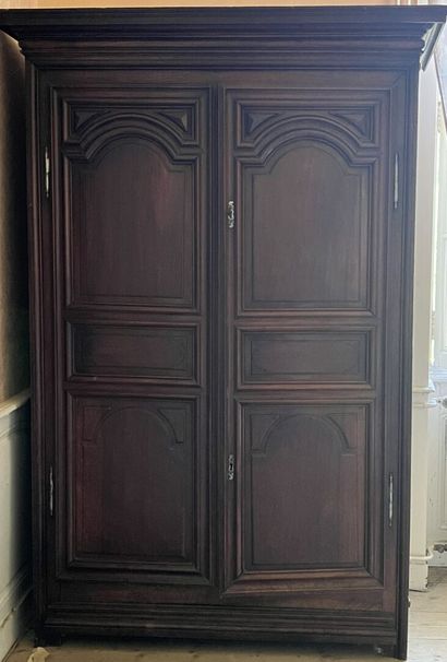 Molded and carved walnut cabinet from the...