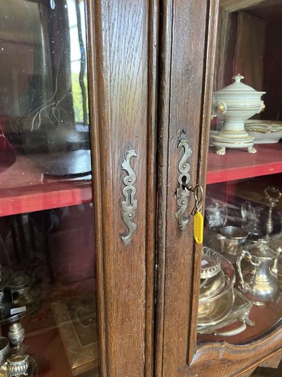 Glass cabinet in natural wood partly from...