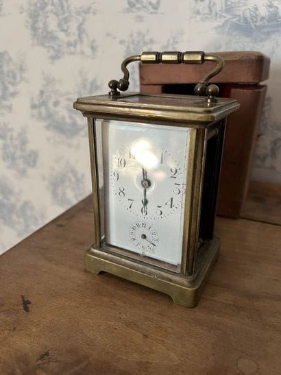 Travelling clock in brass around 1850

In...