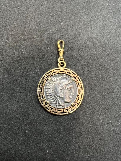 Pendant decorated with a Greek coin in a...