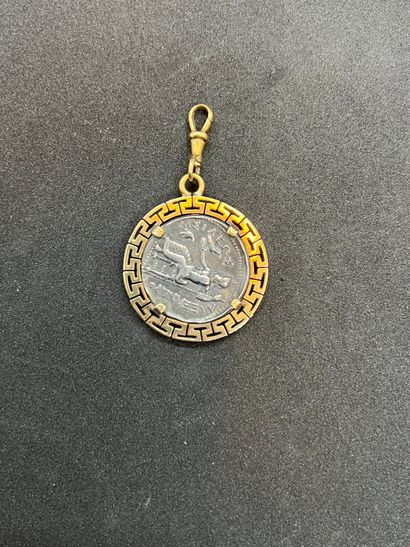 Pendant decorated with a Greek coin in a...