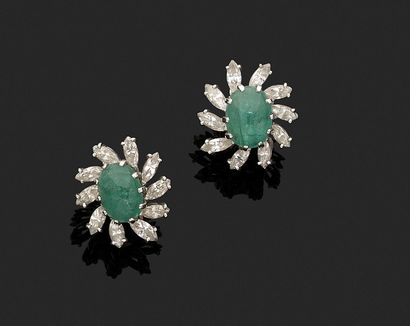 Pair of ear clips adorned with an emerald...