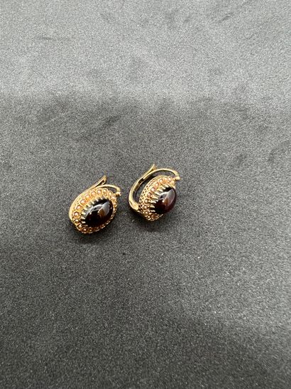 Pair of 18K gold 750‰ sleepers each centered...