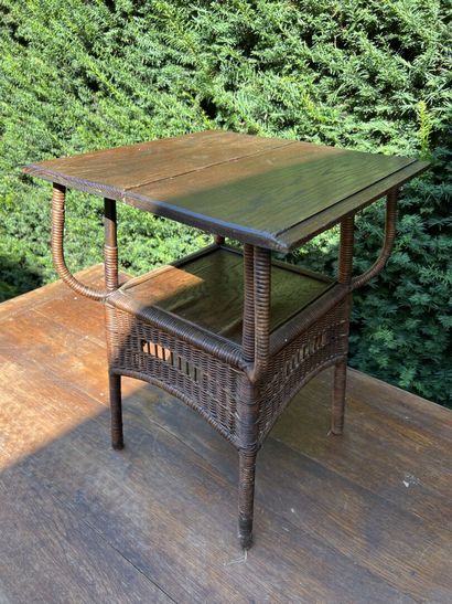 Wood and wicker magazine table

H. 54, W....