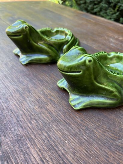 Two ashtrays in green glazed earthenware...