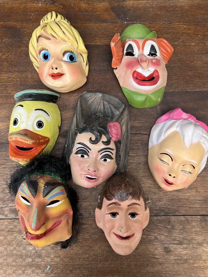 Lot of seven masks decorated with cartoon...